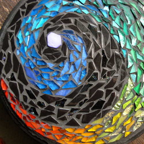 Red Tail Rainbow Mosaic by Margaret Almon, glass on slate, 8 inches.